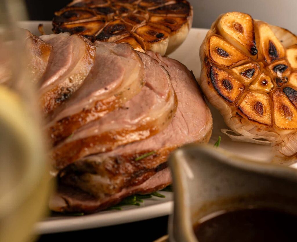Savour succulent roasted meats and grilled garlic at Palm House Boutique Hotel and Spa, renowned for luxurious accommodations and gourmet dining experiences in South Africa.
