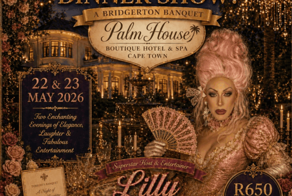 Elegant drag performer Lilly Slaptsill in glamorous costume holding a fan at the Brigerton Dinner event at Palm House Boutique Hotel & Spa, Cape Town, during the Drag Dinner Show.